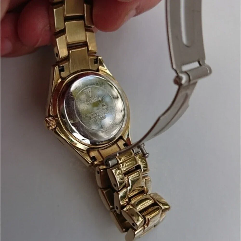 Guess Analog gold tone with rhinestones Watch